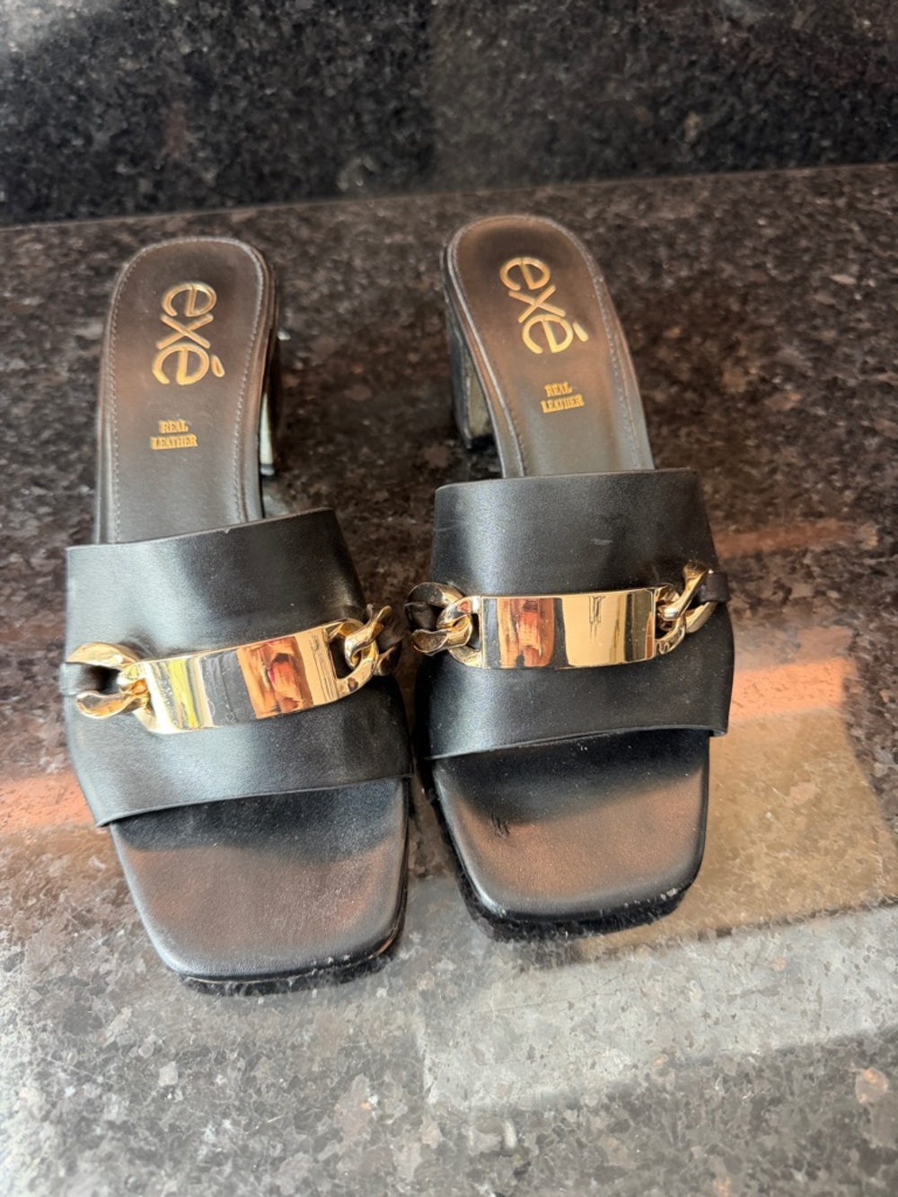 exe Black Leather Slide Mules with Gold Chain Plate